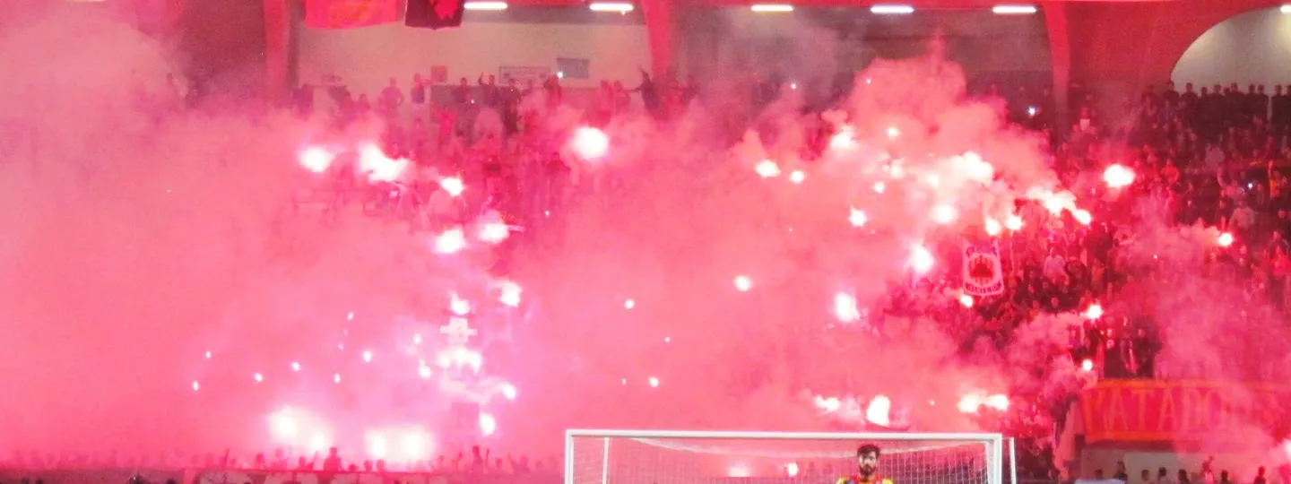 A curva lit with red flares